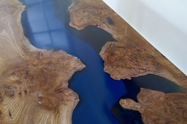 Burr elm and resin coffee table showing wood grain detail