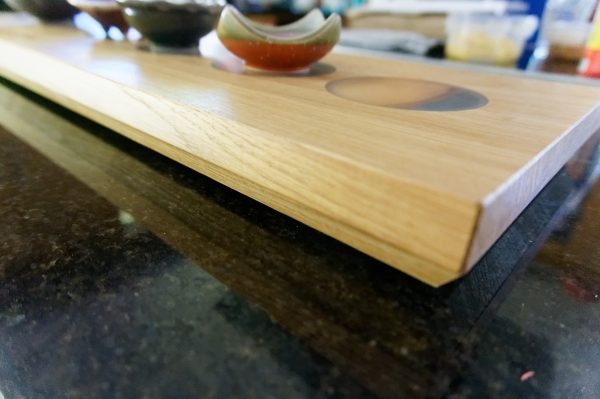 Close up of Oak Charcuterie Board showing 'log' inserts