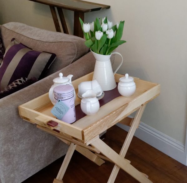 Ash and purple resin table with removable try dressed with tea cups and flowers