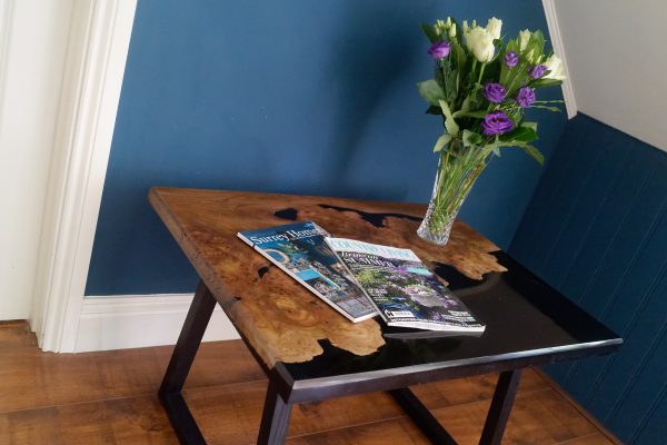 Burr Elm and Black Resin Table with Flower Vase and Magazines