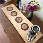 Oak and purple resin Charcuterie Board with flowers glasses and champagne bottle