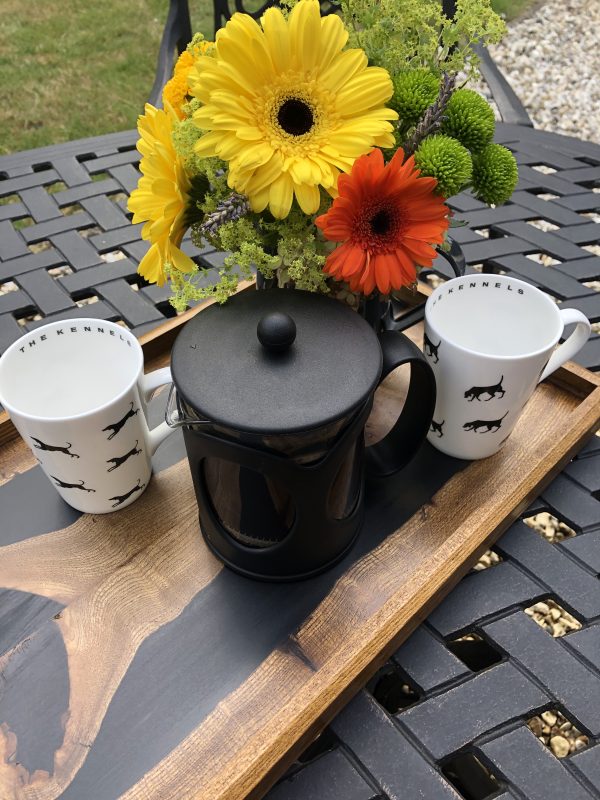 Close Up of Black River Ottoman Tray with Flowers and Coffee