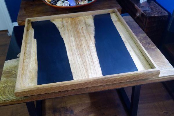 Topside view of large ottoman tray in elm and black resin