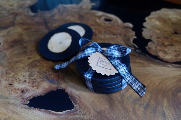 Black Resin Coasters with Log Insets on Coffee Table