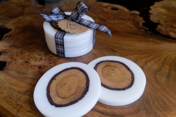 Set of White Coasters with Oak Insets on Table