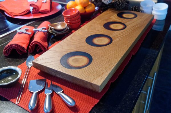 Oak Serving Board with Oak and Blue Resin inserts on Counter Top