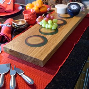 Oak and Resin Charcuterie Serving Board with Cheese and Grapes