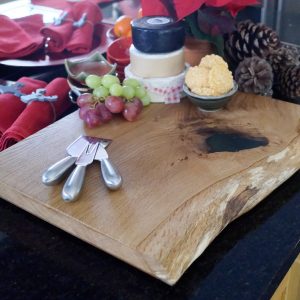Oak Serving Board Decorated with Cheeses and Grapes
