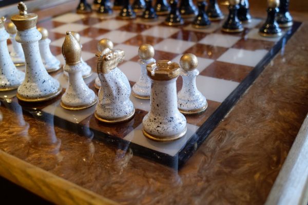Close Up of Chess Board and Hand Painted Pieces