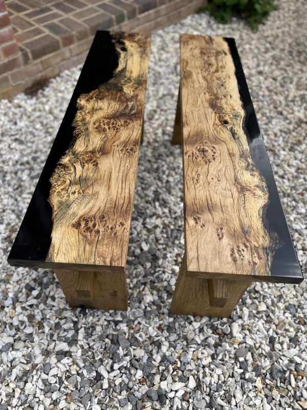 Two matching benches made from English oak and resin