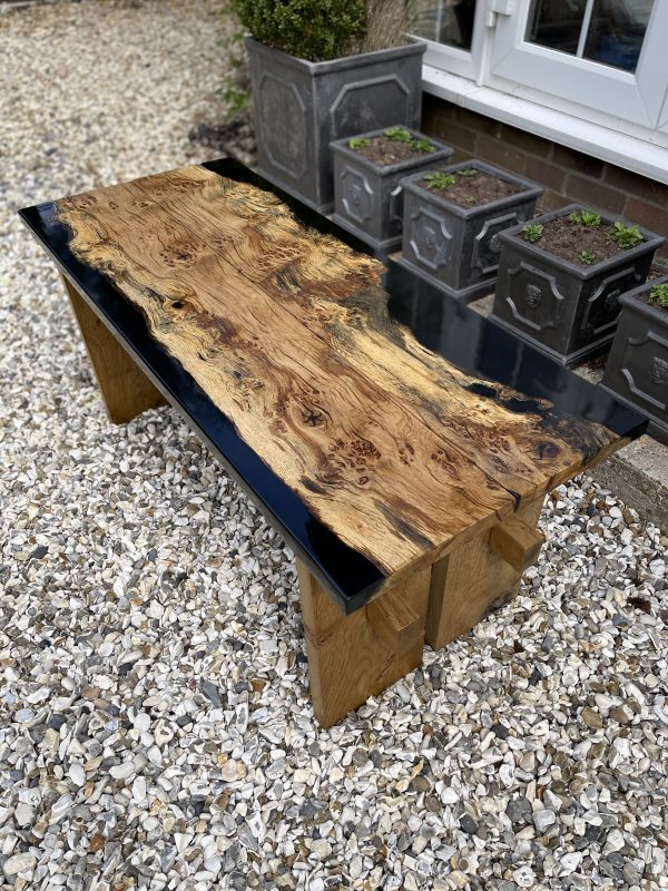 Two oak and black resin benches showing beautiful grain details