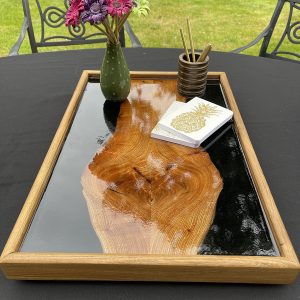 Elm and Black Resin Ottoman Tray on Outside Table