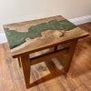 Elm and Green Rose Gold Resin Occasional Table on Wooden floor