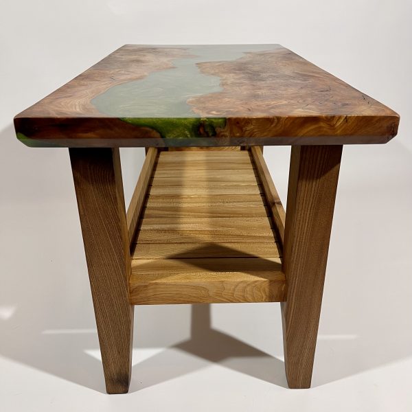 End view of burr elm table with resin and a magazine tray