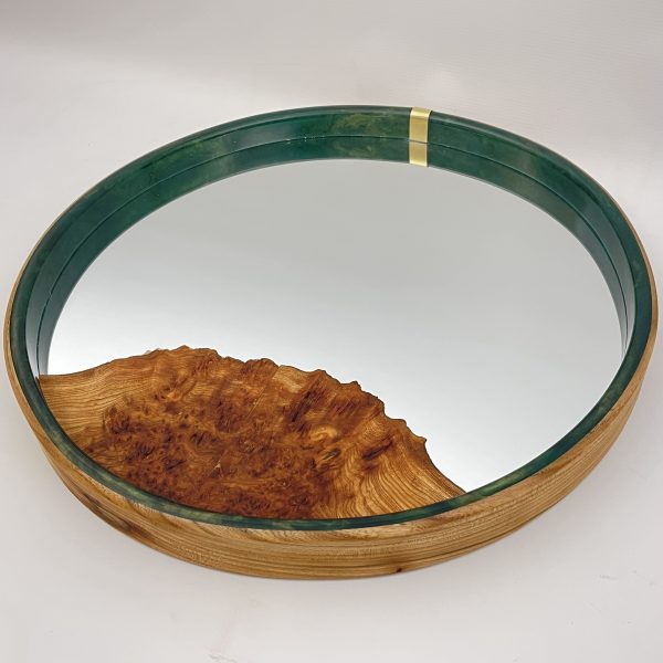 Top view of large round mirror made with elm and teal resin and a burr elm inlay