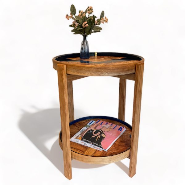 Round occasional table dressed with accessory items